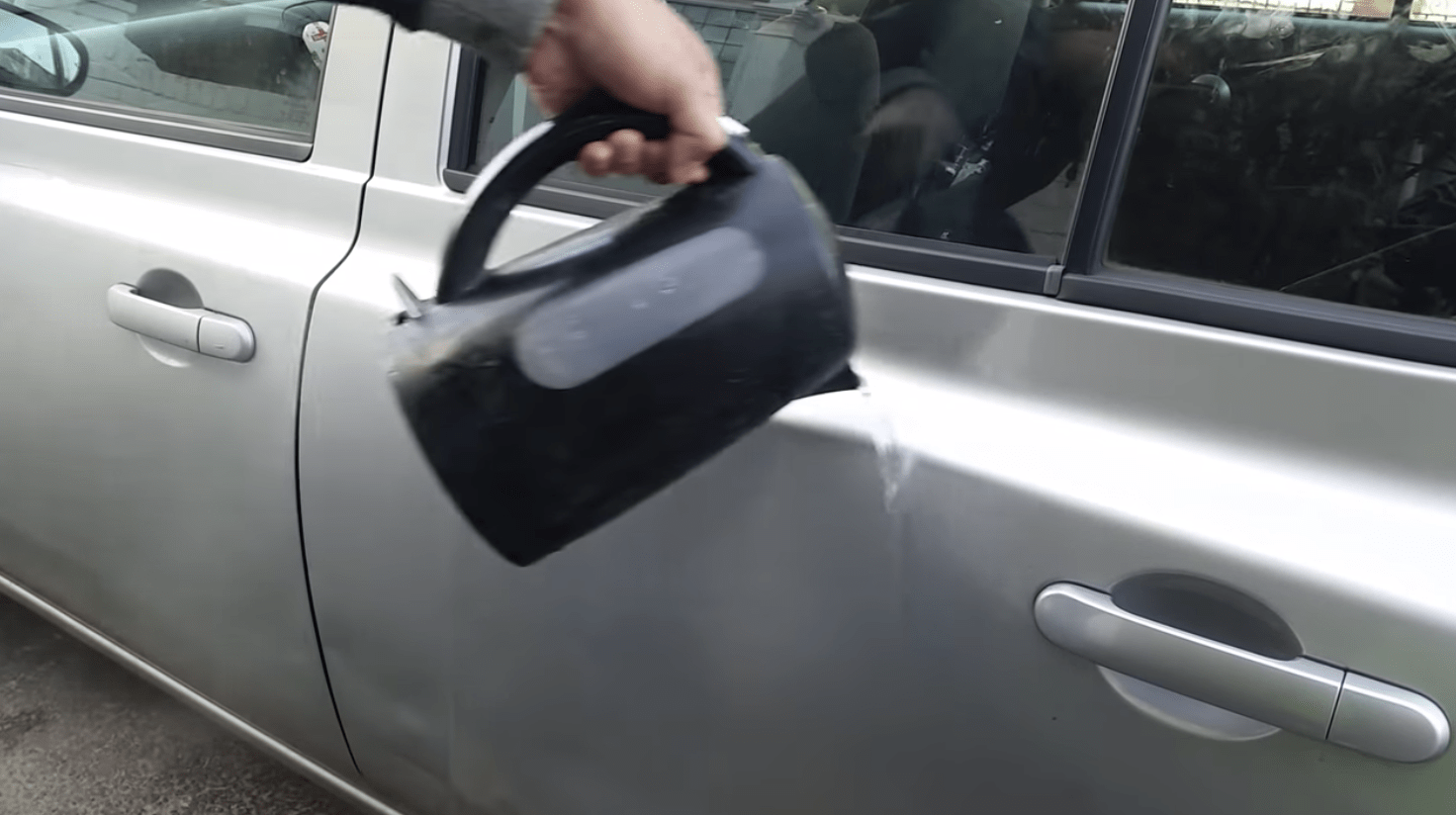 He pours some boiling water on his car and then this happens!